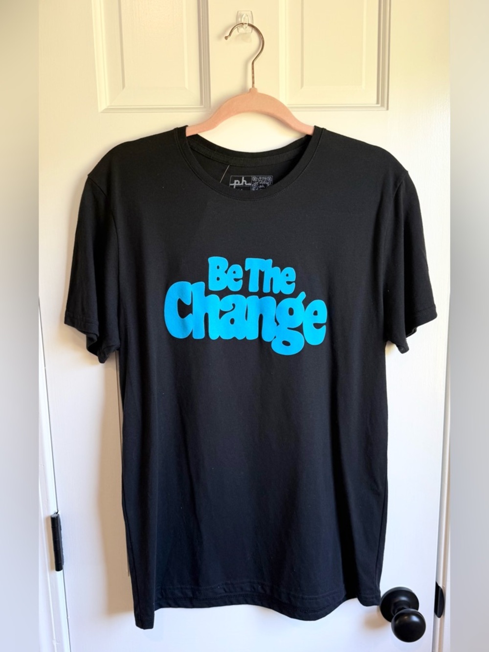 The Phluid Project Black Tee with Bright Blue "Be The Change" Print